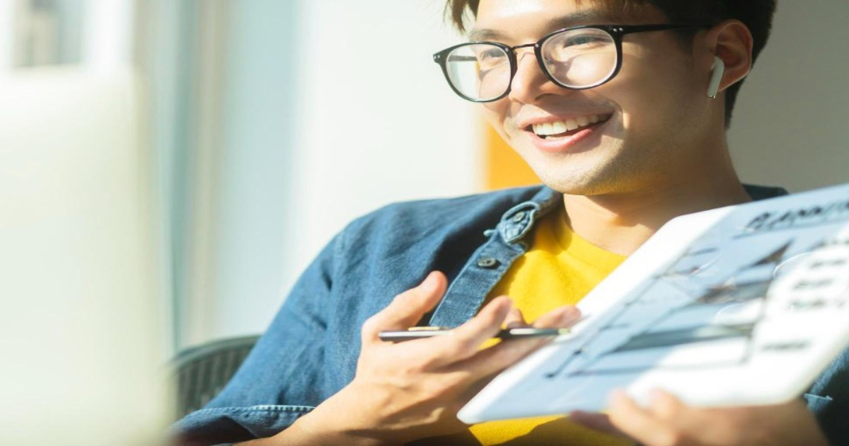 IB maths tuition Singapore student studying analysis and approaches with a graphing calculator