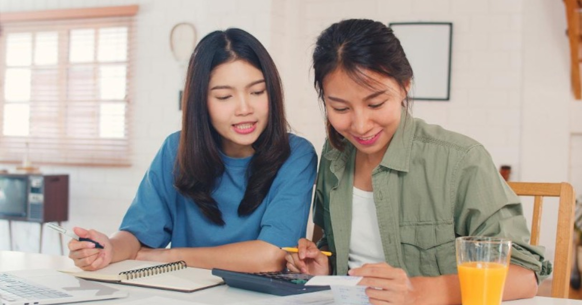 PSLE maths tuition Singapore tutor guiding a primary school student through a worksheet